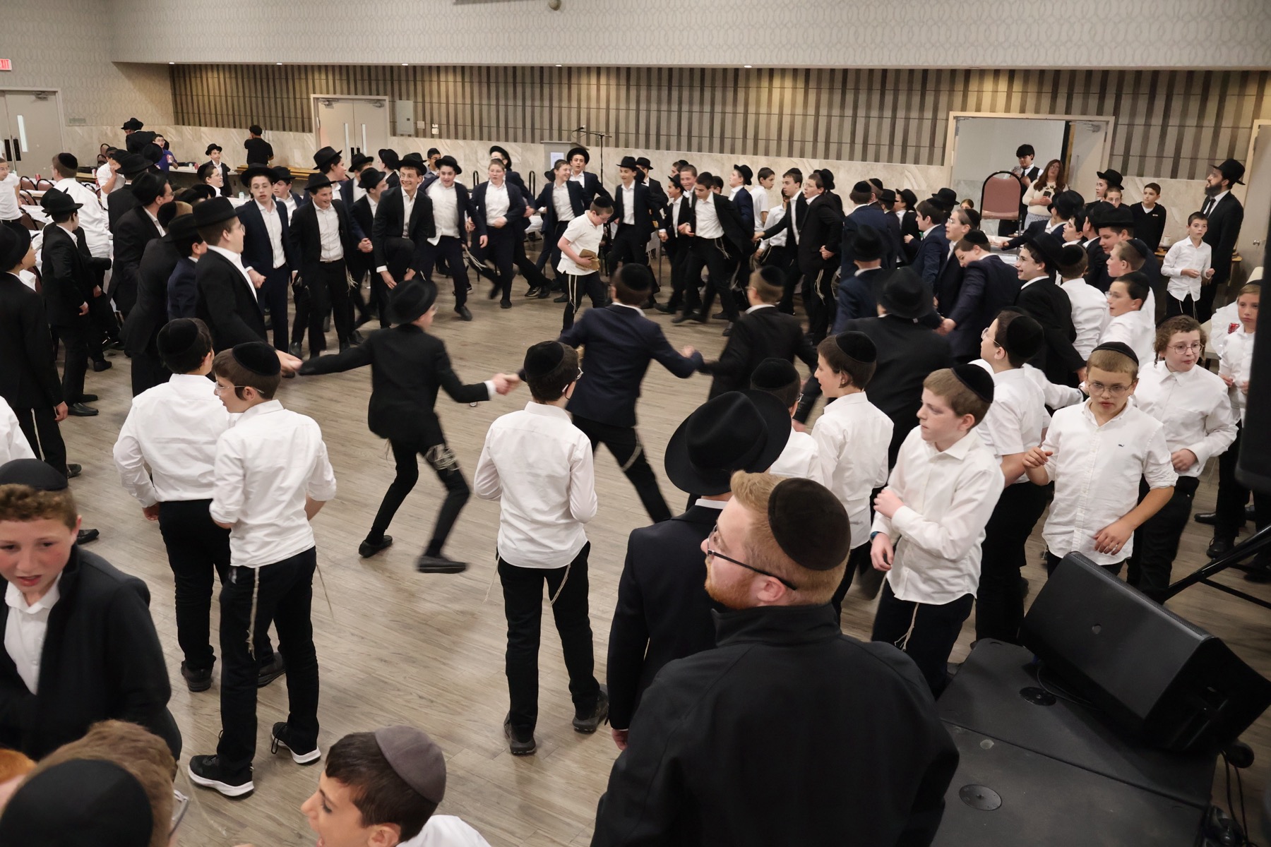 Bonim U'Bonim participants dancing together at a large gathering