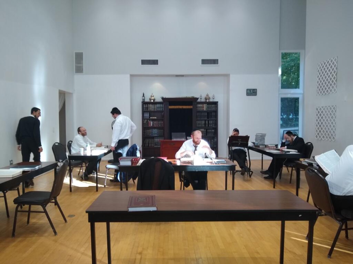 Two people learning together in a community kollel